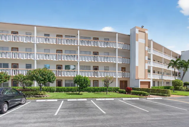 a view of a building with a yard