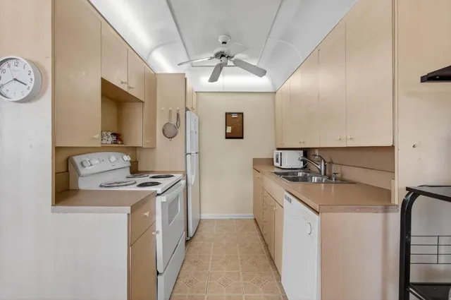 a view of a workspace with furniture and wooden floor