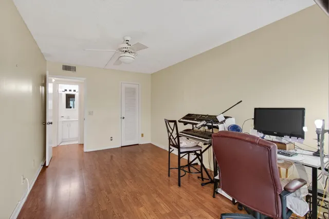 a view of a lake with houses in the back