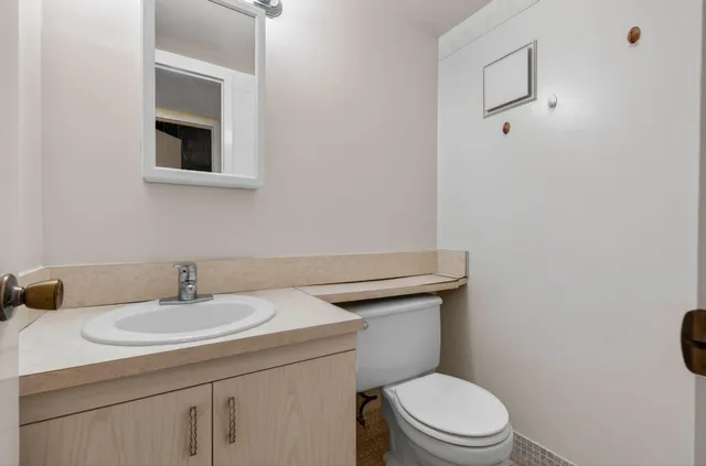 a view of a lake with houses in the back