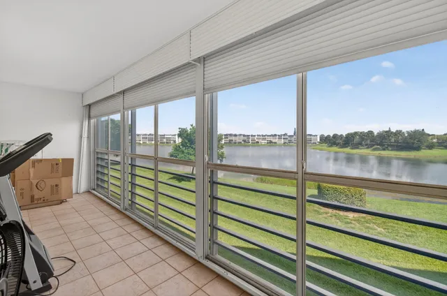 a view of a house with a yard and entertaining space
