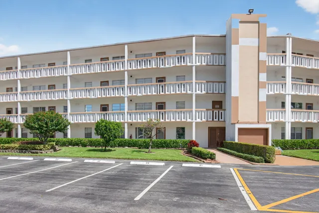 a front view of building with yard