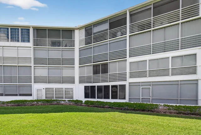 a very nice looking dining room with lots of furniture