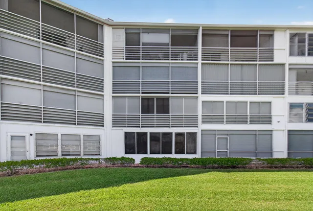 a view of a patio with table and chairs and potted plants
