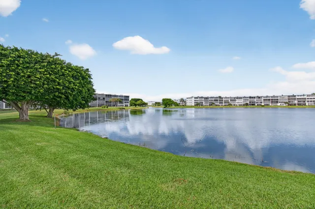 an aerial view of multiple houses with yard