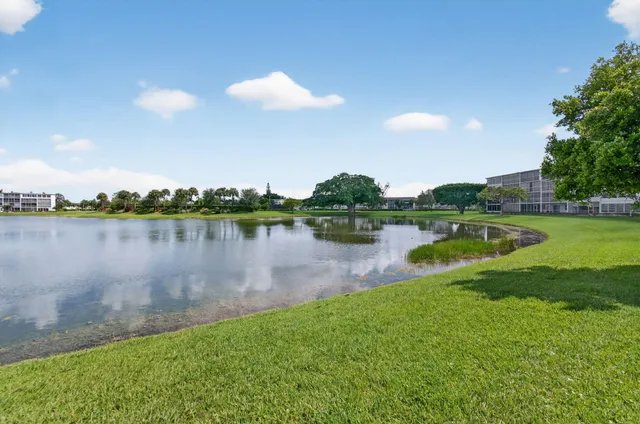 an aerial view of a house with garden space and street view
