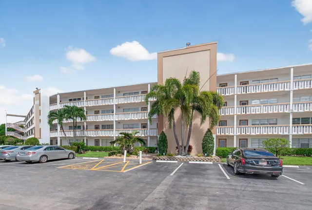 a view of a living room kitchen and a window