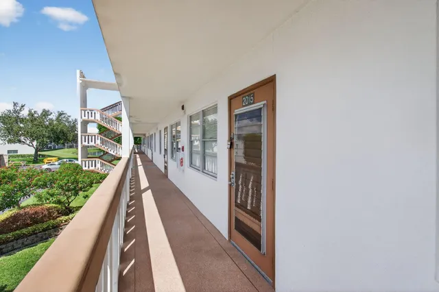 a view of a livingroom with furniture window and wooden floor