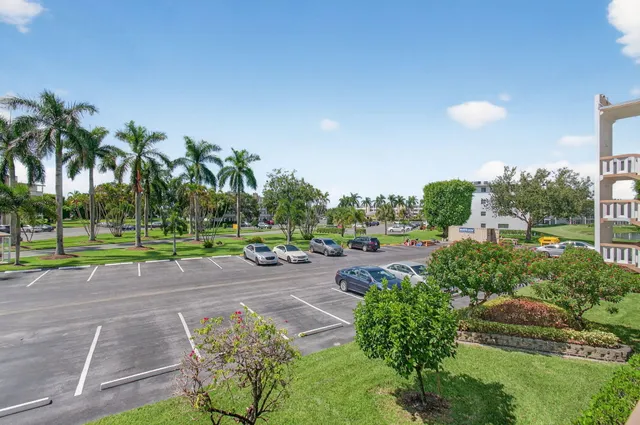 a view of work space with wooden floor and furniture