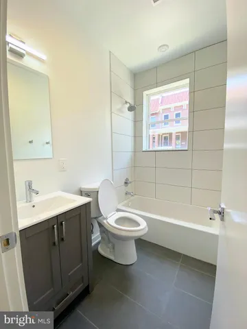 a view of a hallway with washer and dryer
