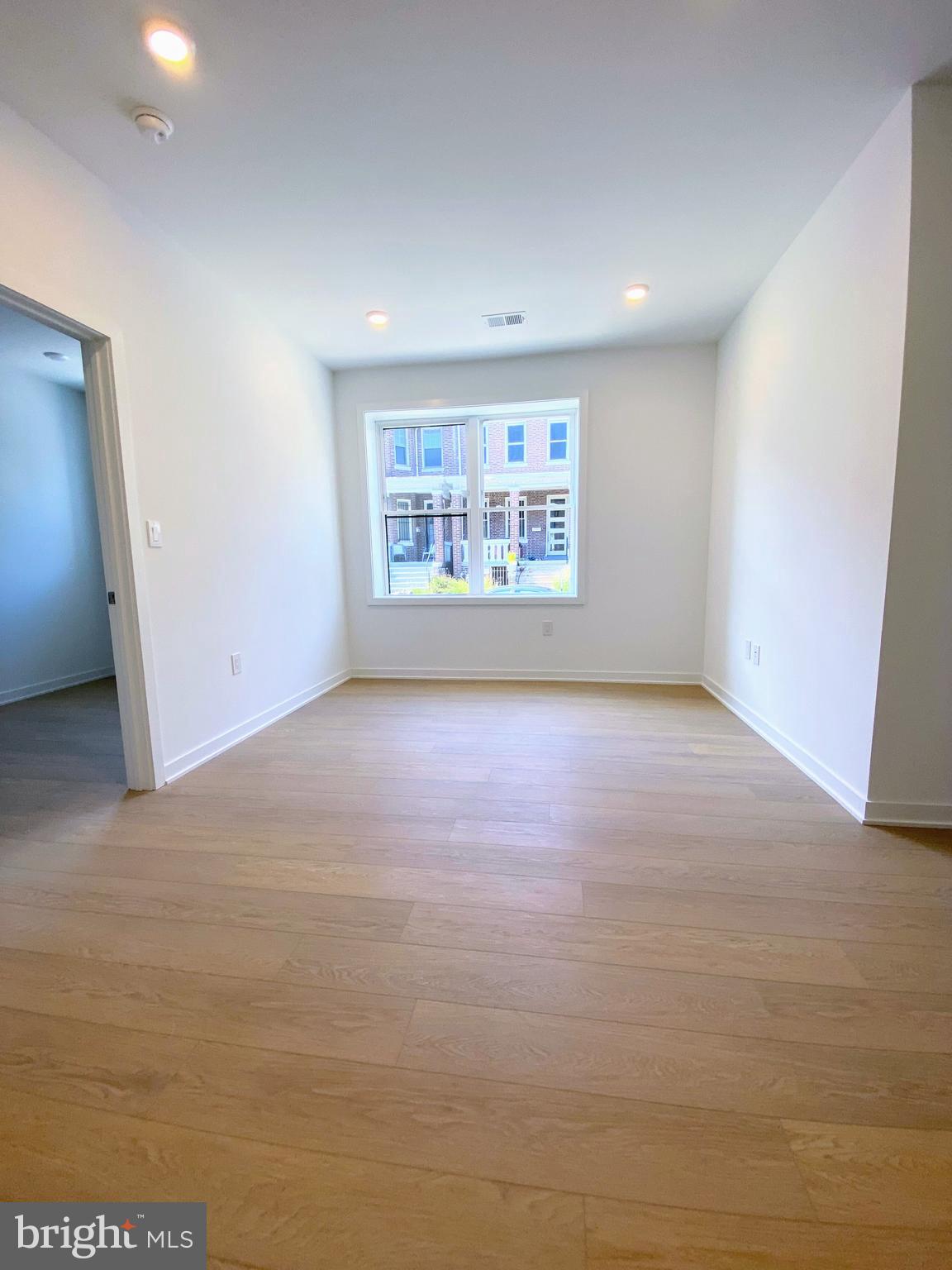 3435 Brown Street Northwest, Unit 1 Washington, DC 20010 - Photo 3 of 13 a view of an empty room with a window