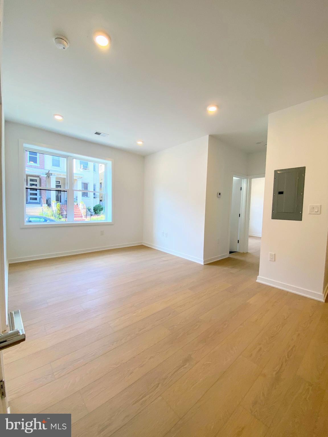 3435 Brown Street Northwest, Unit 1 Washington, DC 20010 - Photo 4 of 13 a view of an empty room with a window