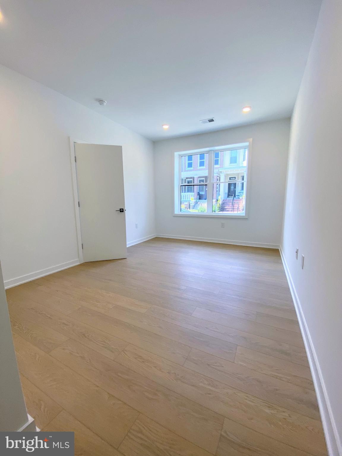 3435 Brown Street Northwest, Unit 1 Washington, DC 20010 - Photo 7 of 13 a view of an empty room with a window