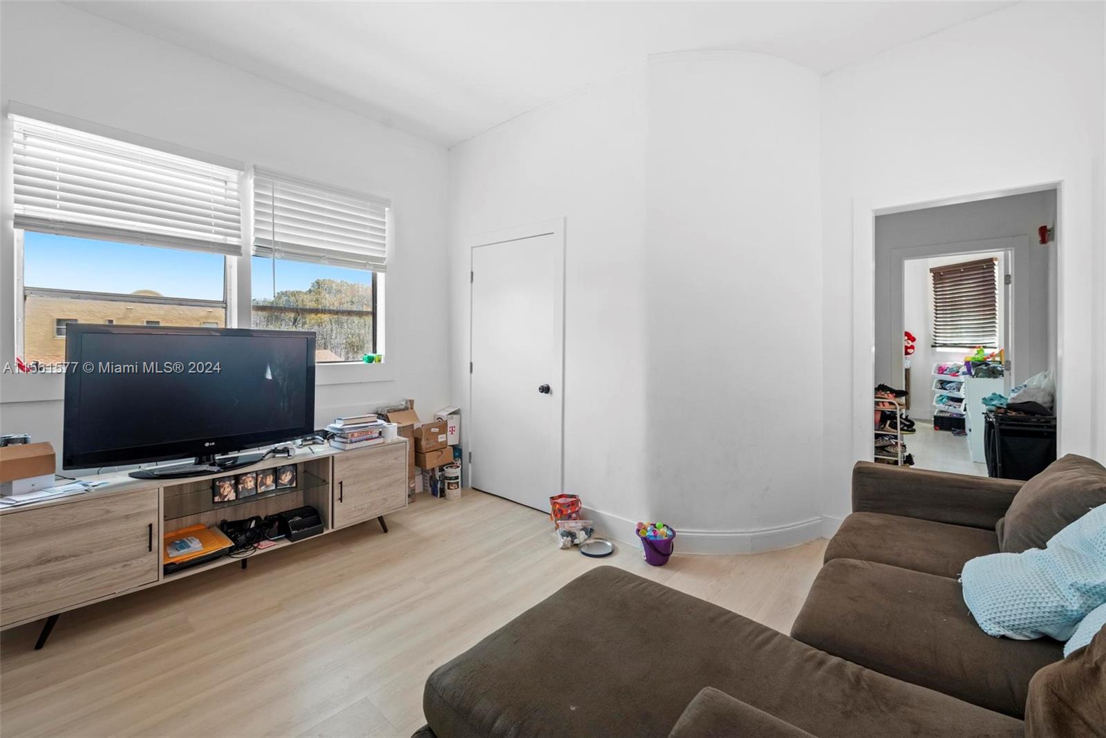 1785 Southwest 13th Street Miami, FL 33145 - Photo 13 of 16 a living room with furniture and a flat screen tv