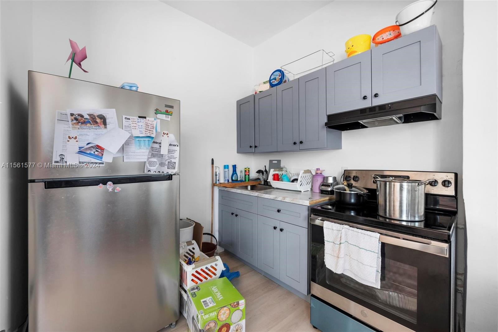 1785 Southwest 13th Street Miami, FL 33145 - Photo 14 of 16 a kitchen with stainless steel appliances granite countertop a refrigerator and a stove top oven