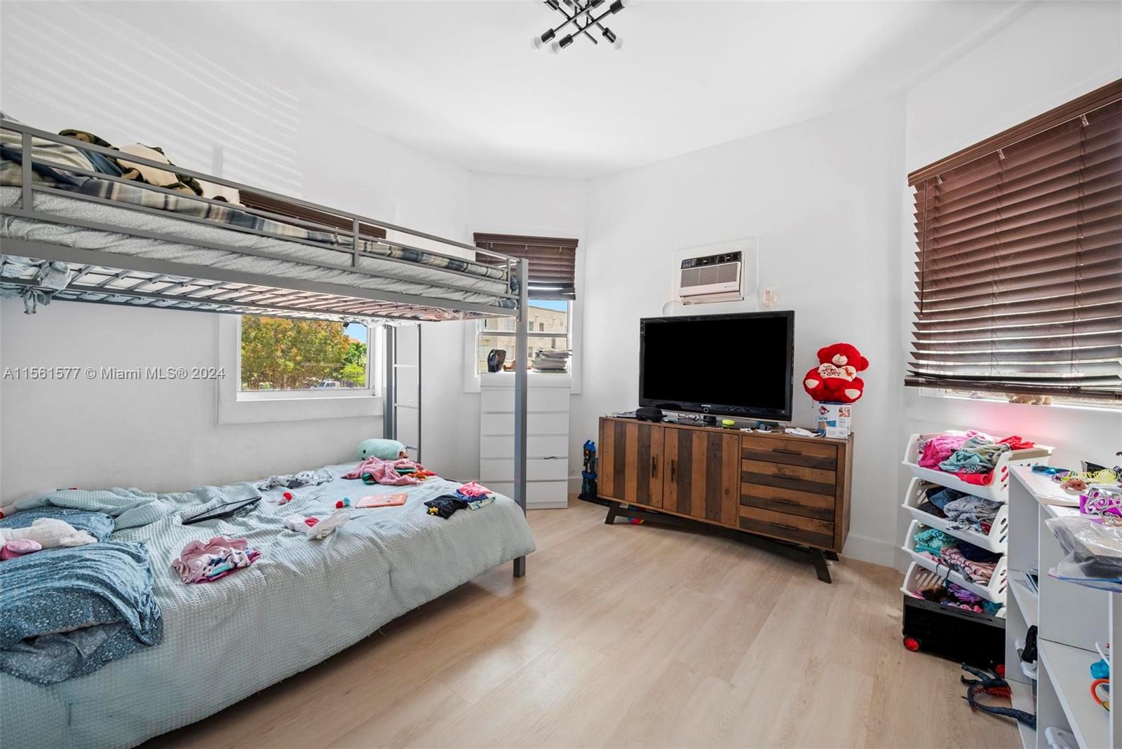 1785 Southwest 13th Street Miami, FL 33145 - Photo 15 of 16 a bedroom with a bed and flat screen tv