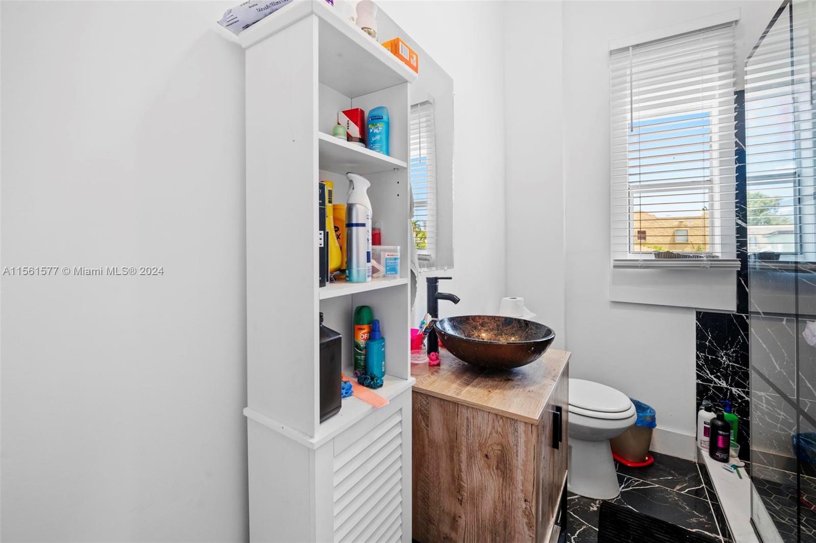 1785 Southwest 13th Street Miami, FL 33145 - Photo 16 of 16 a room that has a bed and a chair in it