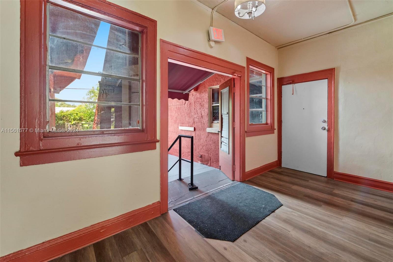 1785 Southwest 13th Street Miami, FL 33145 - Photo 6 of 16 a view of an empty room with wooden floor and a window