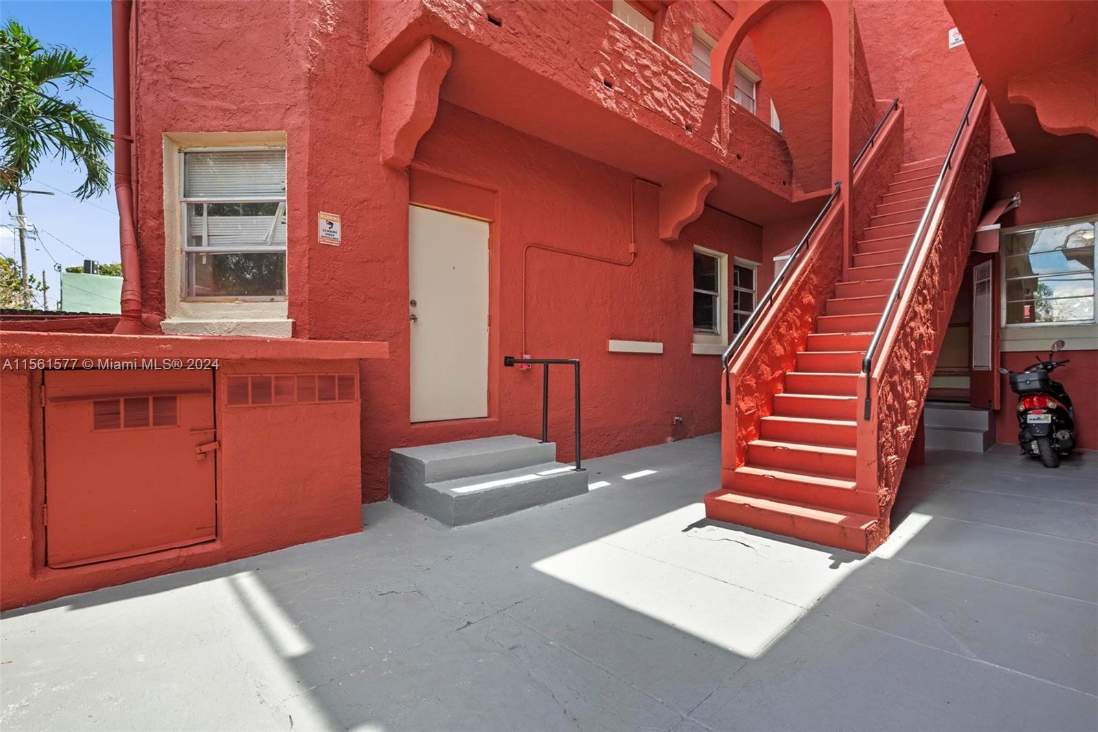 1785 Southwest 13th Street Miami, FL 33145 - Photo 9 of 16 a backyard of a house with wooden stairs and stairs