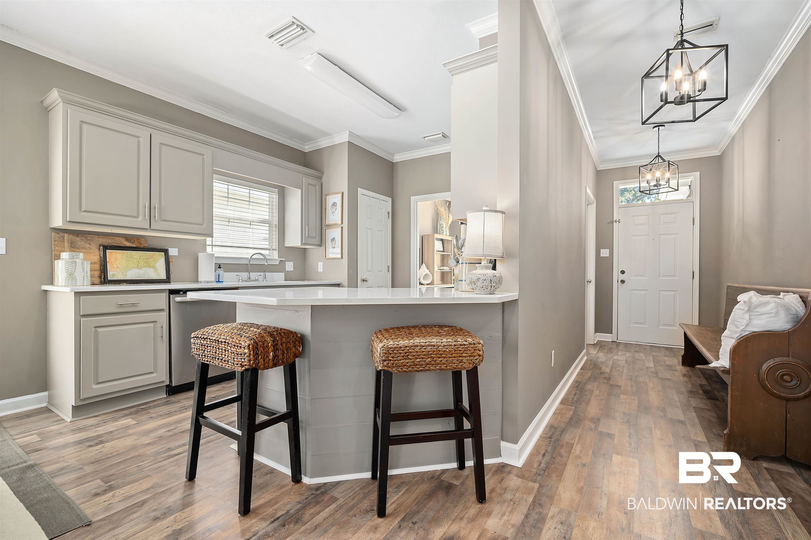 27288 Parker Lane Daphne, AL 36526 - Photo 8 of 29 Kitchen with a breakfast bar, a peninsula, dishwasher, light wood finished floors, and a chandelier
