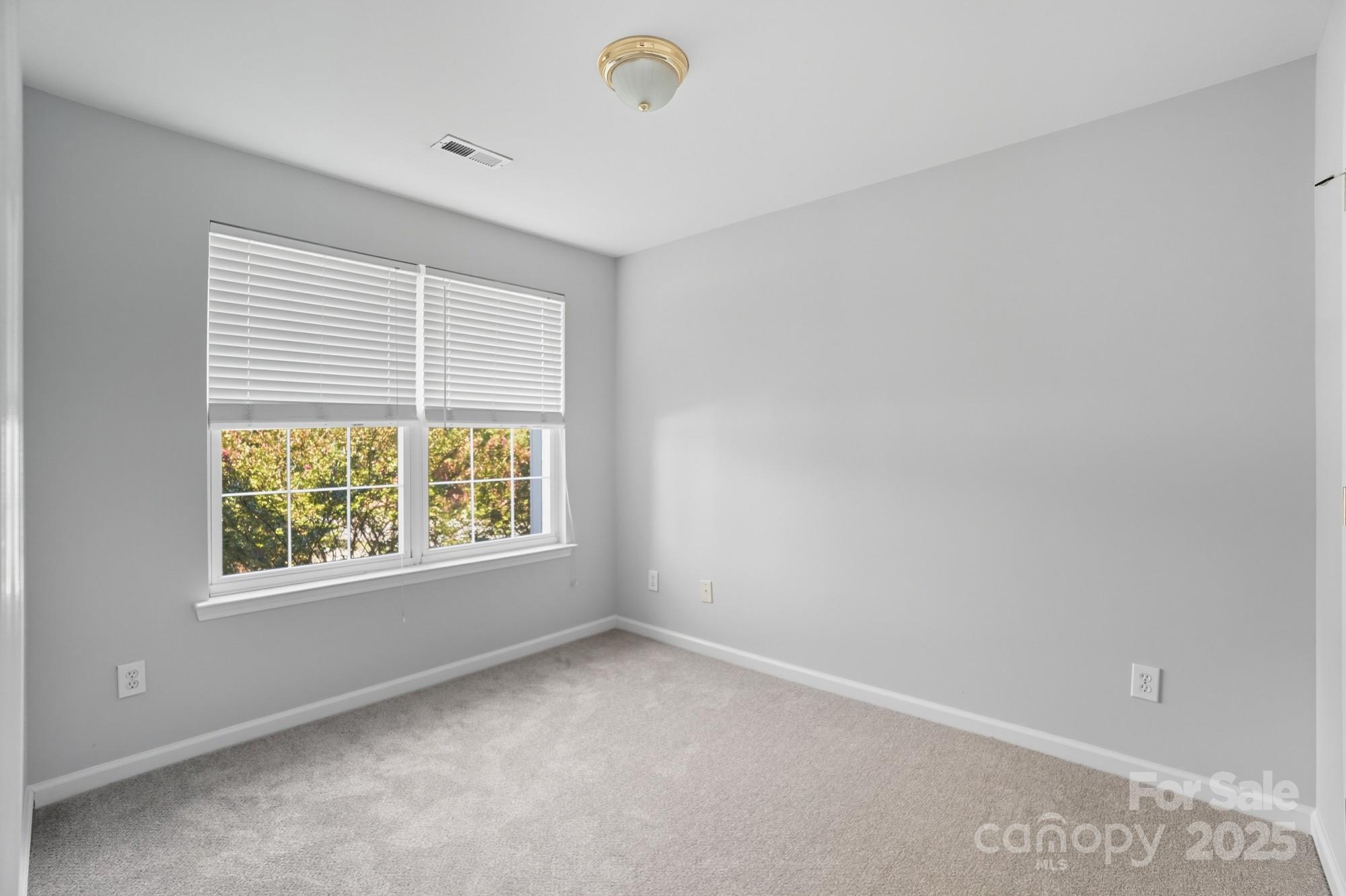 507 Poseidon Way Fort Mill, SC 29708 - Photo 13 of 19 a view of an empty room with a window
