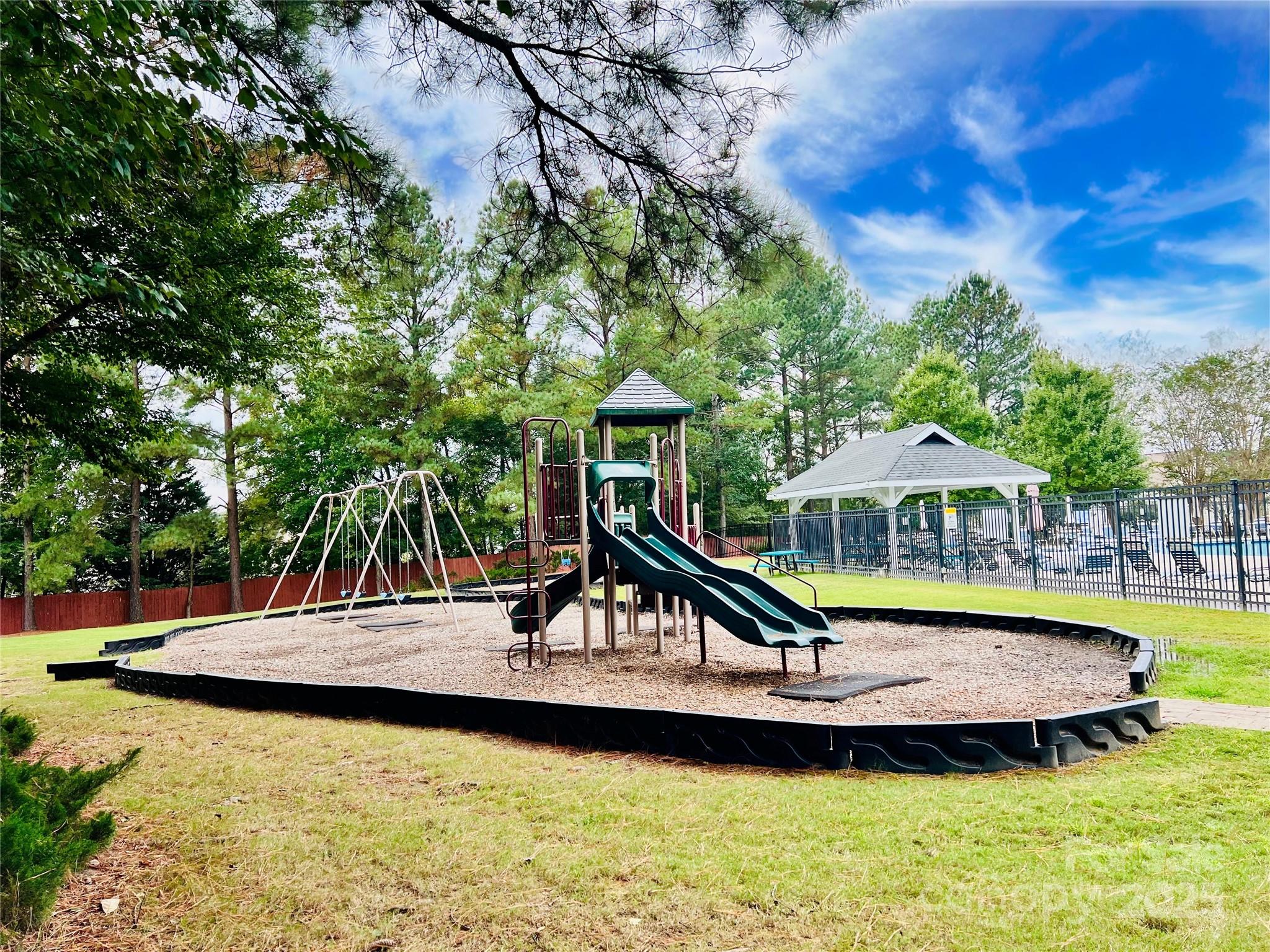 507 Poseidon Way Fort Mill, SC 29708 - Photo 18 of 19 a house view with a swimming pool and sitting space