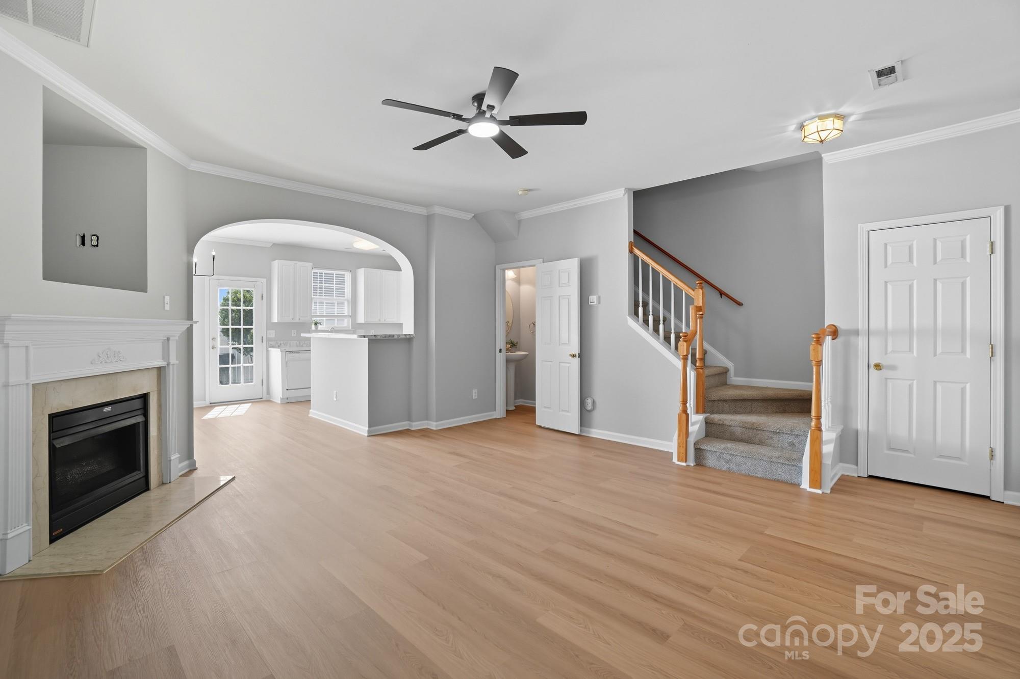 507 Poseidon Way Fort Mill, SC 29708 - Photo 3 of 19 a view of empty room with wooden floor and fireplace