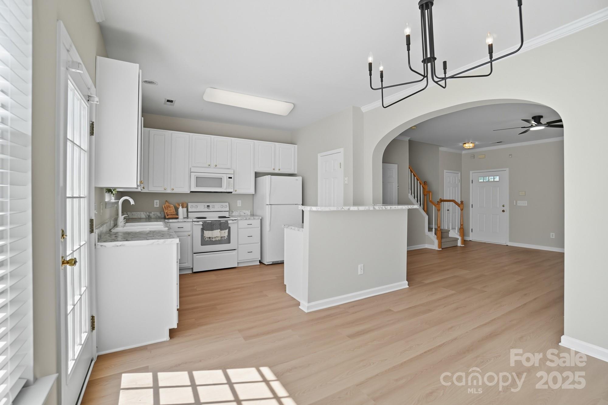 507 Poseidon Way Fort Mill, SC 29708 - Photo 5 of 19 a view of a kitchen with wooden floor and electronic appliances