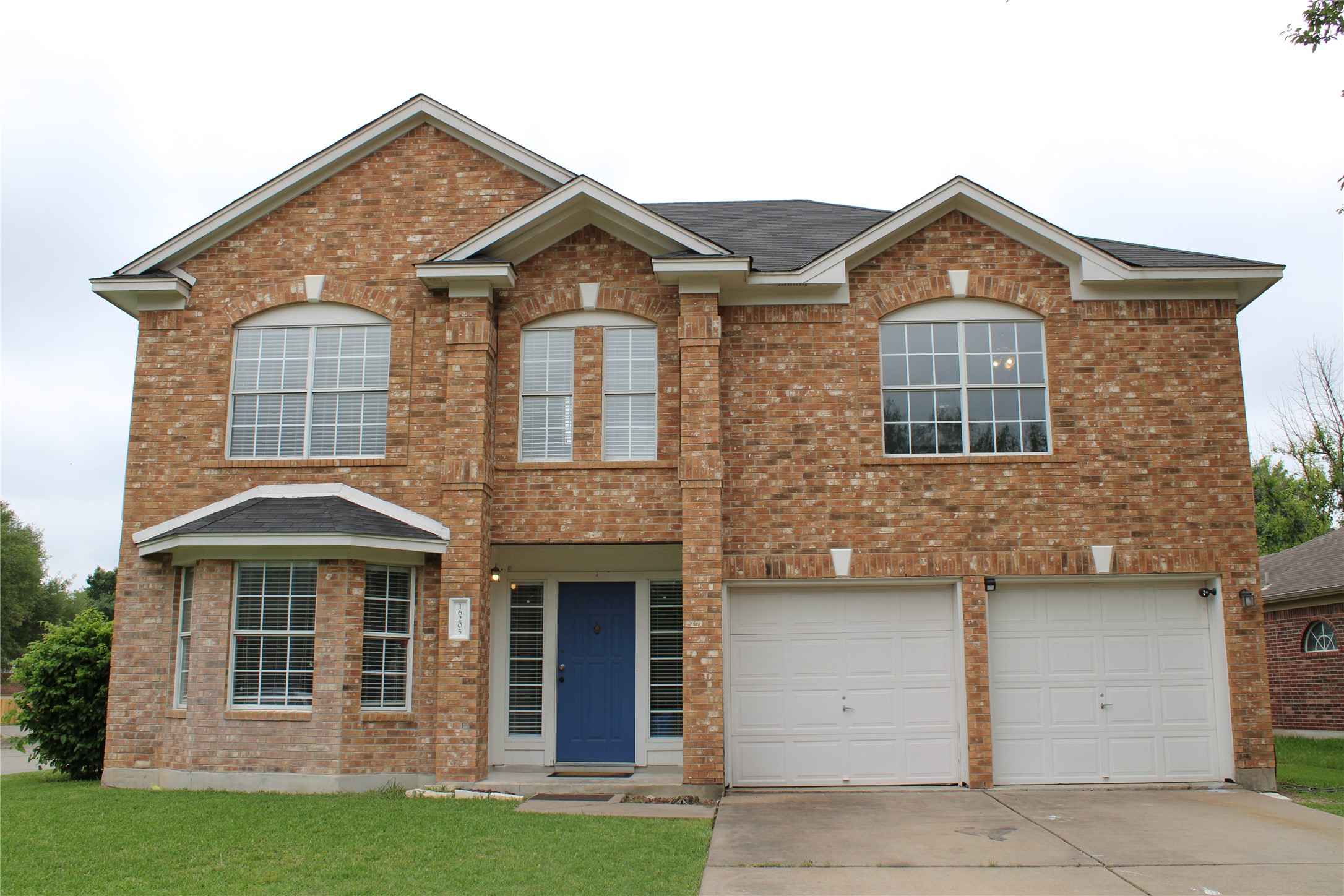 16205 Glorious Lane Pflugerville, TX 78660 - Photo 1 of 30 a front view of a house with a yard