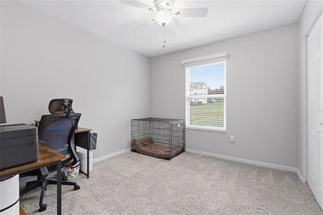 a workspace with furniture and a window