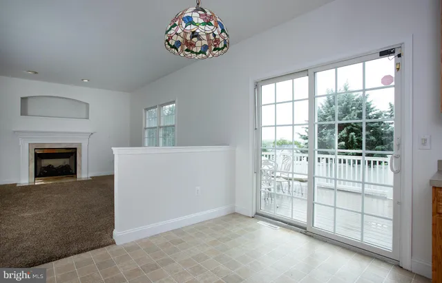 a bathroom with a granite countertop sink mirror and toilet