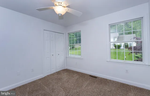 a view of room with wooden floor