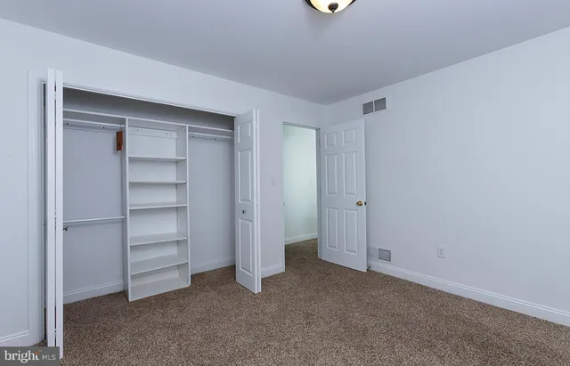 a house view with swimming pool and sitting area