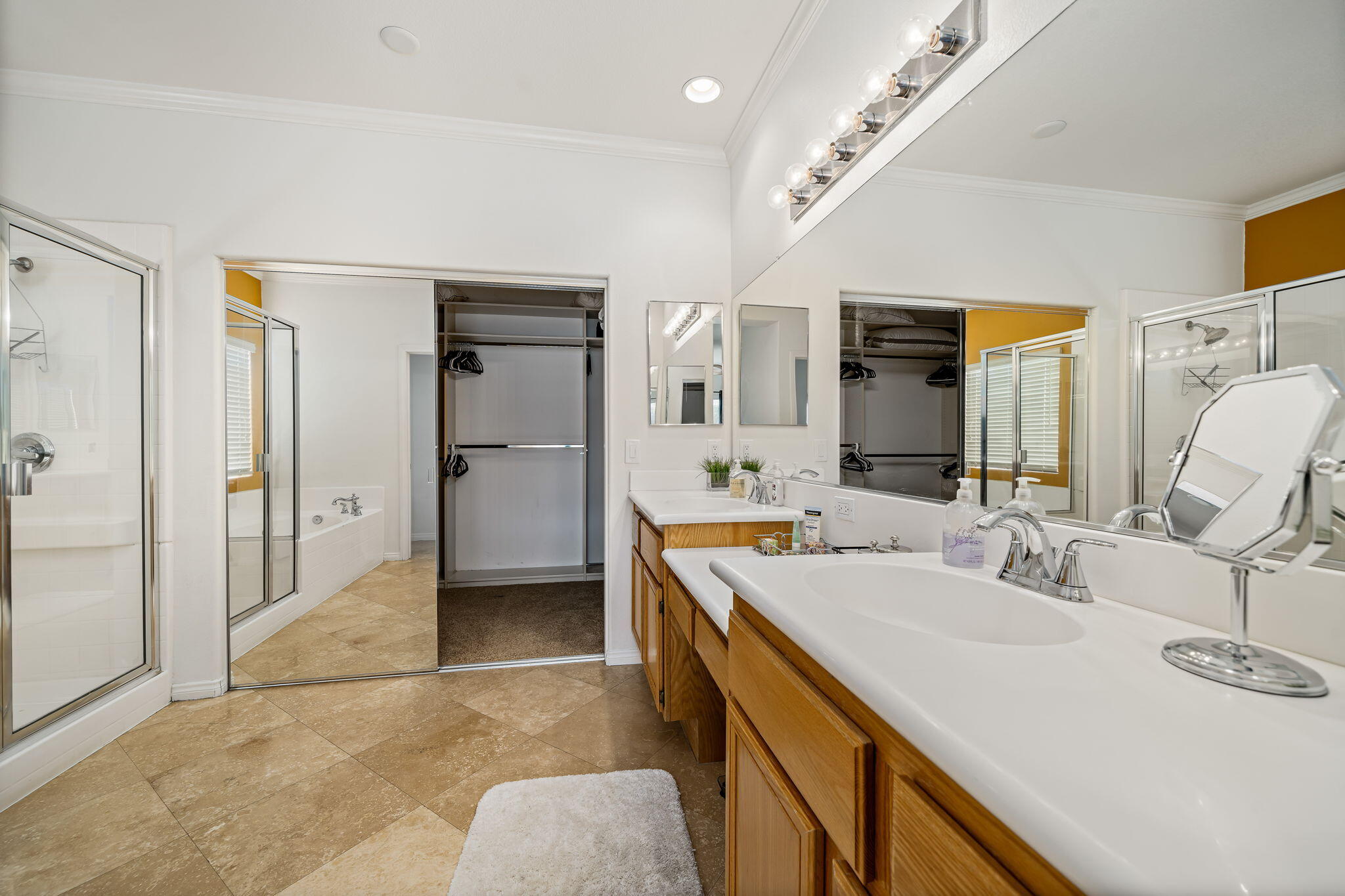 41222 Mackenzie Lane Indio, CA 92203 - Photo 15 of 27 a spacious bathroom with a sink double vanity and a mirror