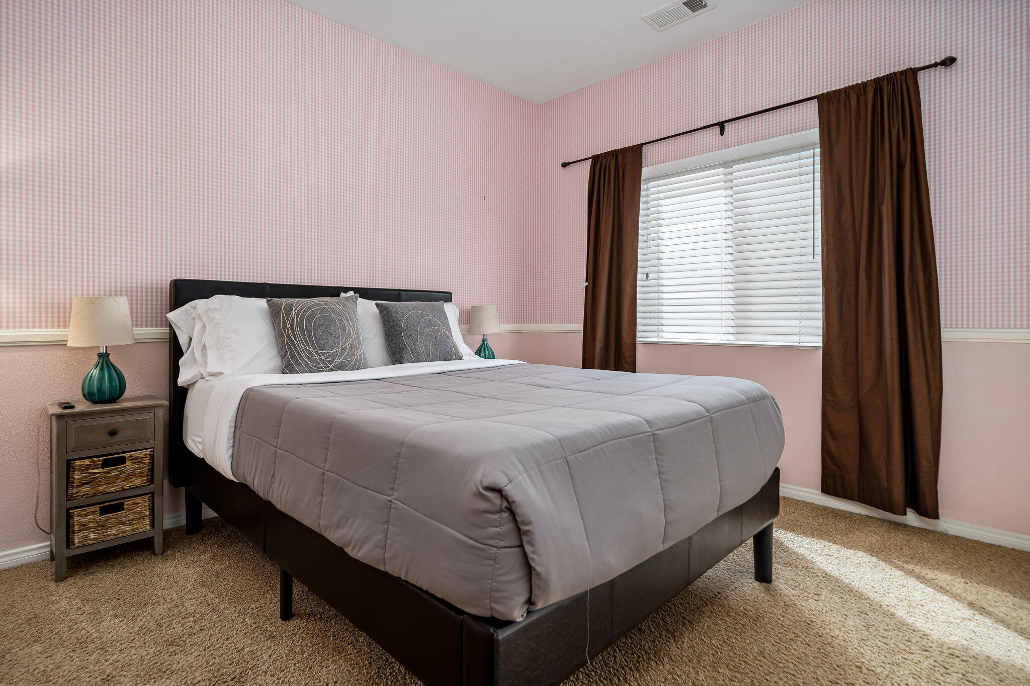 41222 Mackenzie Lane Indio, CA 92203 - Photo 16 of 27 a bed sitting in a bedroom next to a window and dresser