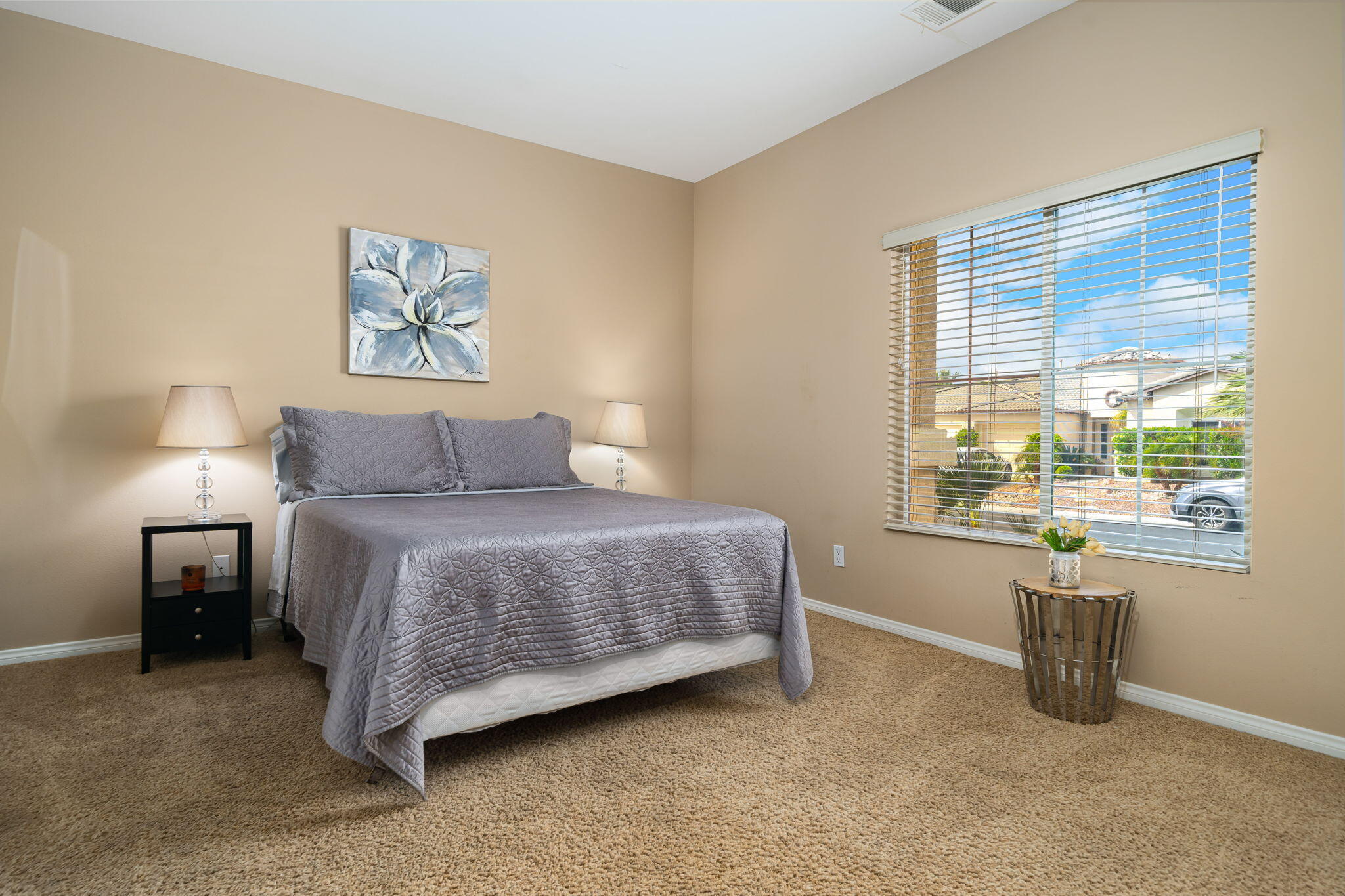 41222 Mackenzie Lane Indio, CA 92203 - Photo 17 of 27 a bedroom with a bed and a large window