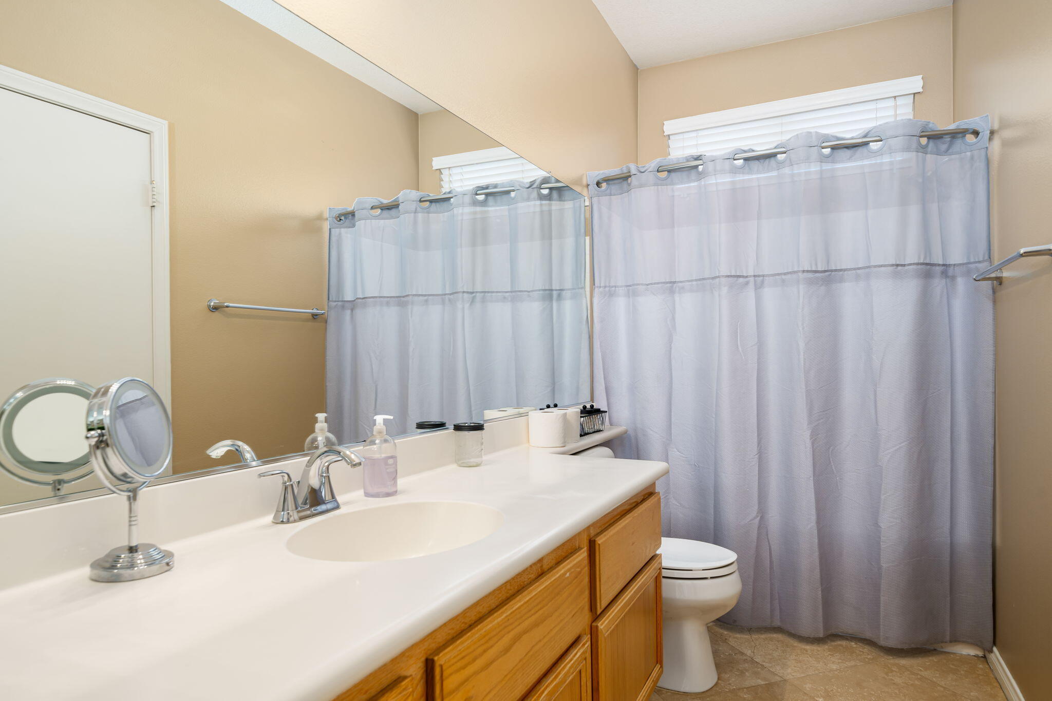 41222 Mackenzie Lane Indio, CA 92203 - Photo 18 of 27 a bathroom with a sink and a mirror
