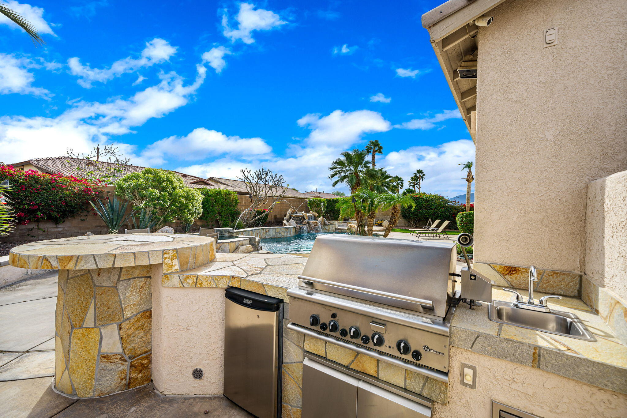 41222 Mackenzie Lane Indio, CA 92203 - Photo 27 of 27 a view of a kitchen with a stove and a microwave