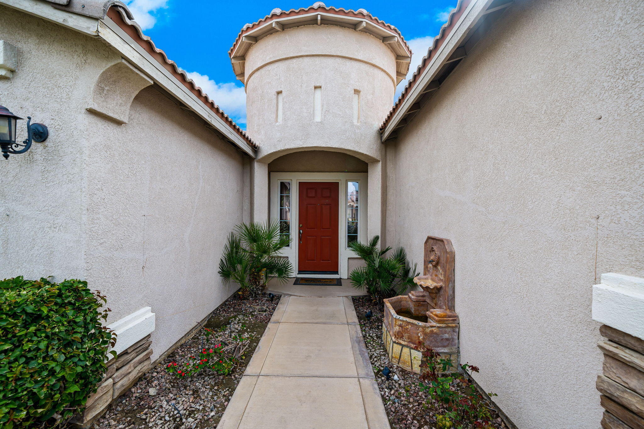 41222 Mackenzie Lane Indio, CA 92203 - Photo 3 of 27 a front view of a house with garden