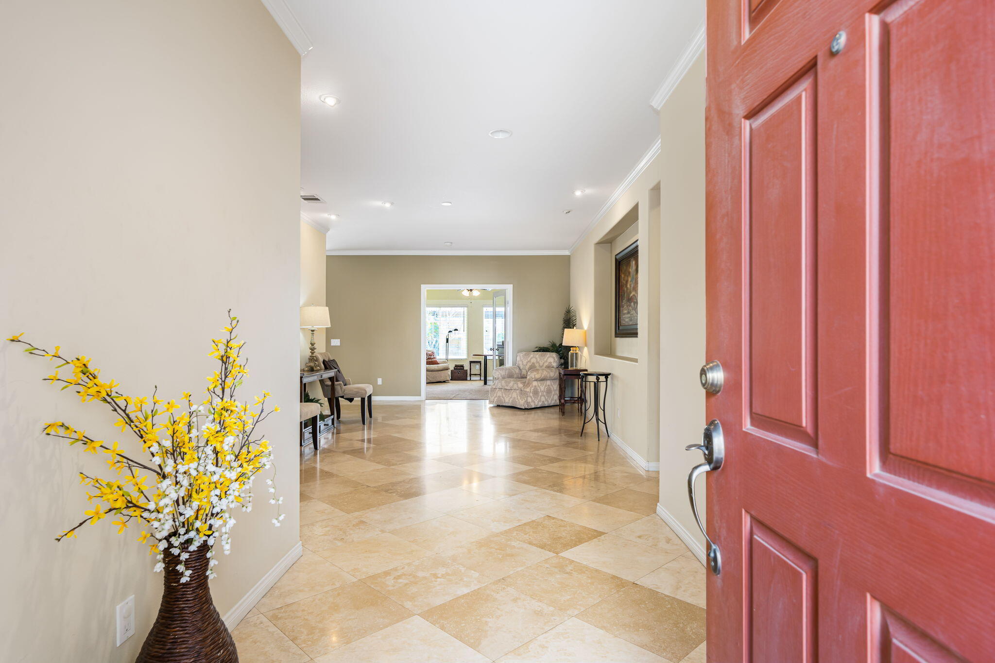 41222 Mackenzie Lane Indio, CA 92203 - Photo 4 of 27 a living room with furniture and a potted plant
