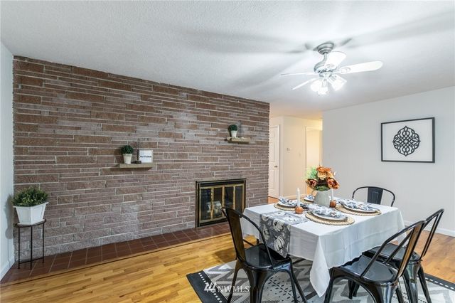 a dining room with furniture and wooden floor