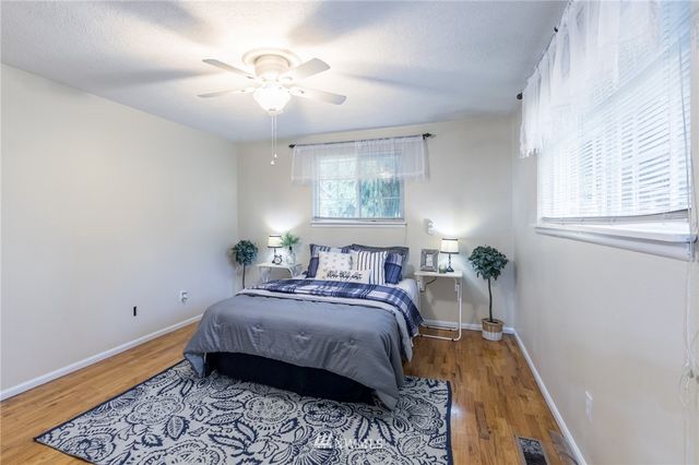 a bed room with a bed and a window