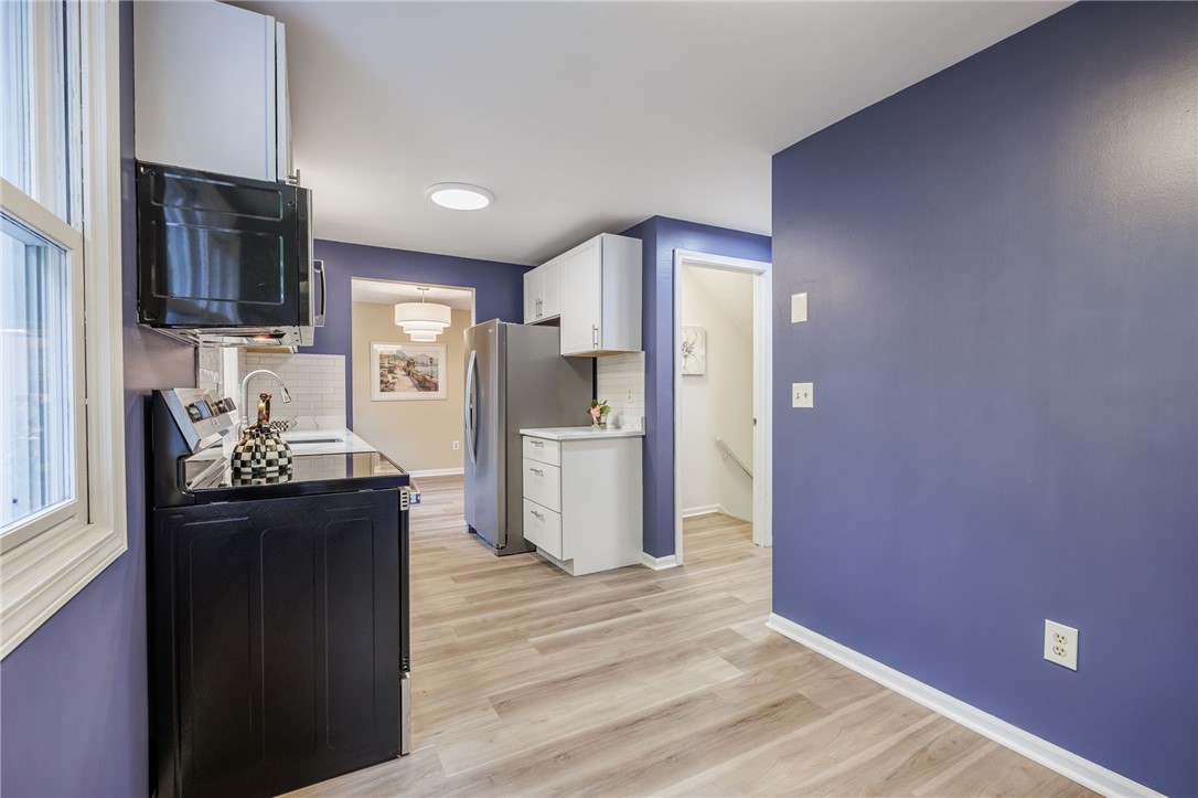 3431 South Winton Road Henrietta, NY 14623 - Photo 9 of 37 Extra wall space and entry to garage and basement