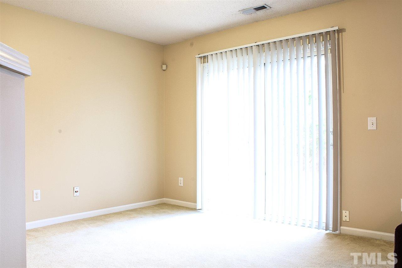 2912 Tuckland Drive Raleigh, NC 27610 - Photo 11 of 25 a view of an empty room with a window