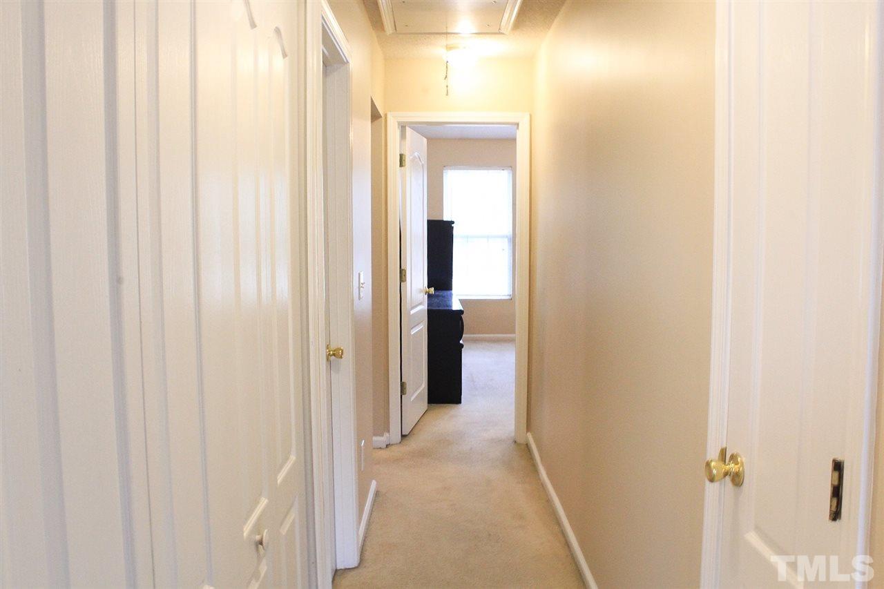 2912 Tuckland Drive Raleigh, NC 27610 - Photo 17 of 25 a view of a bathroom from a hallway