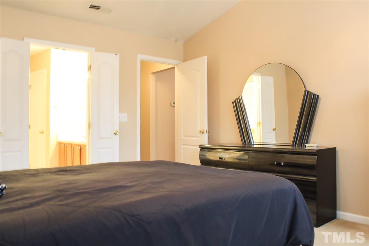 2912 Tuckland Drive Raleigh, NC 27610 - Photo 19 of 25 a bedroom with a bed and a window