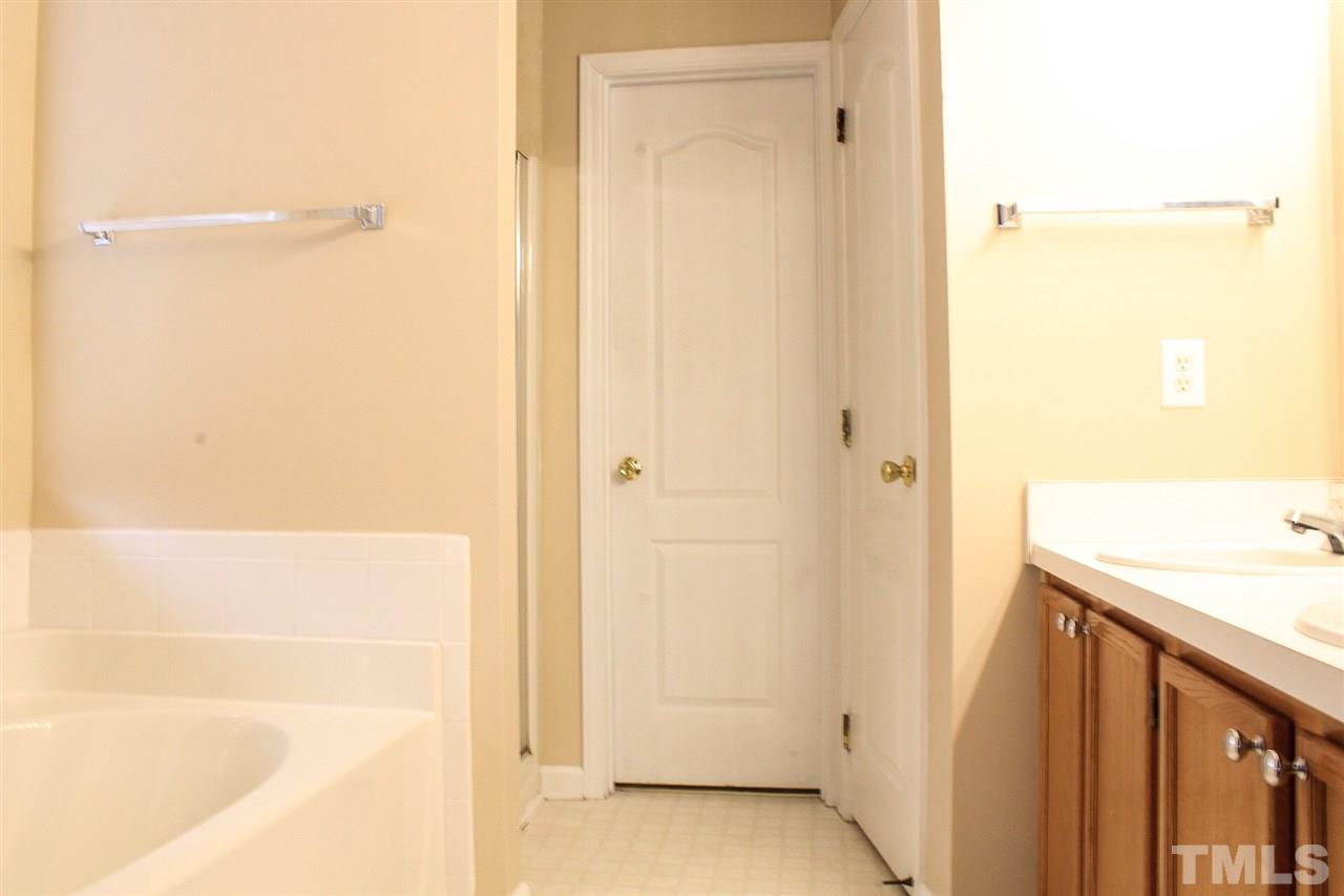 2912 Tuckland Drive Raleigh, NC 27610 - Photo 20 of 25 a bathroom with a shower and a sink