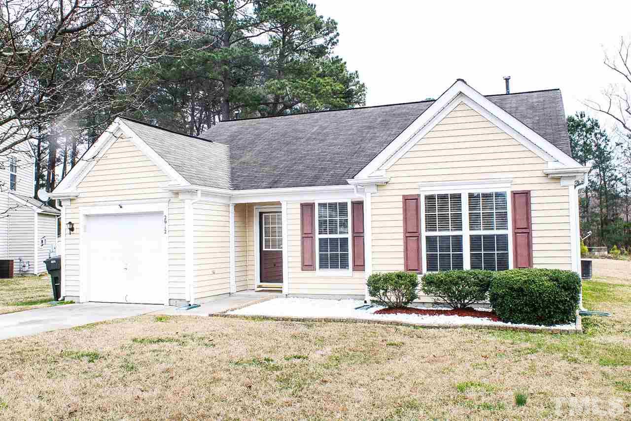 2912 Tuckland Drive Raleigh, NC 27610 - Photo 3 of 25 a view of a house with a yard and potted plants