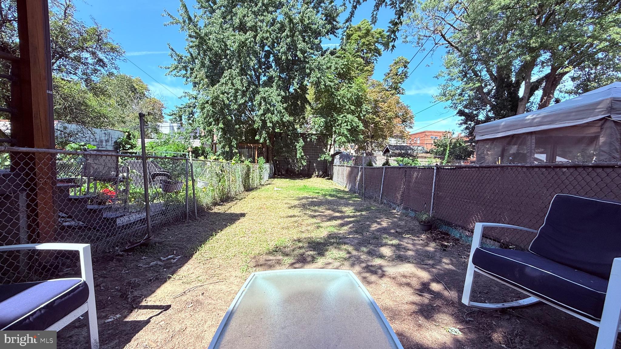 6424 Bingham Street Philadelphia, PA 19111 - Photo 15 of 32 a view of a chairs and tables in the backyard