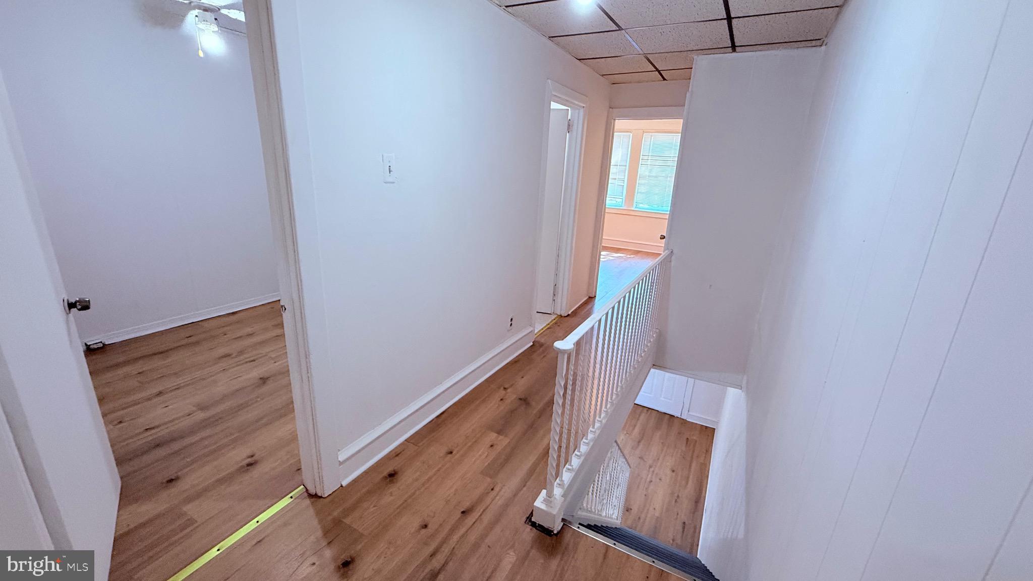 6424 Bingham Street Philadelphia, PA 19111 - Photo 18 of 32 a view of a hallway with wooden floor and stairs